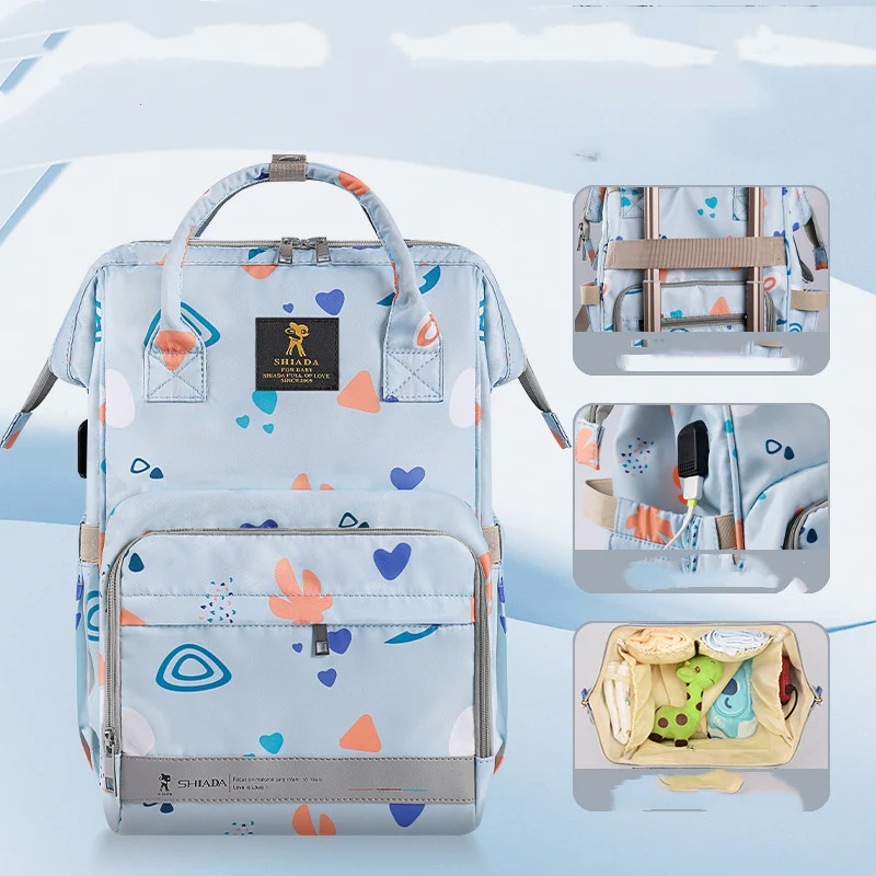 Mochila Mommy New Fashion para mães modernas e bebês. Design trendy, ombros confortáveis e amplo espaço para itens essenciais do bebê. — foto 3