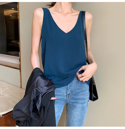 Title 14, Sling chiffon vest with a loose fit, offering a...