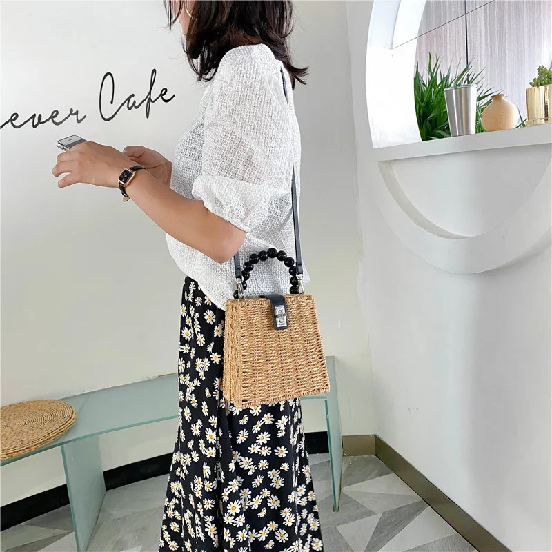 Portable beaded straw rattan bag for women, a stylish and natural choice perfect for the beach, travel or everyday use. — photo 1