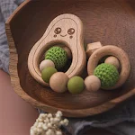 Enfeite de pulseira infantil Brinquedo de madeira para bebês Mordedor de abacate Cordão Seguro e natural para aliviar a coceira da gengiva do bebê — foto 5