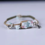 Pulseira de couro de vaca com notas de liga bordadas, design elegante e duradouro, perfeita para um estilo único e moderno. — foto 10