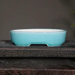 Desktop Oval Ceramic Purple Clay Flowerpot perfect for flowers. Enhance your workspace with this elegant and stylish flo — photo 1