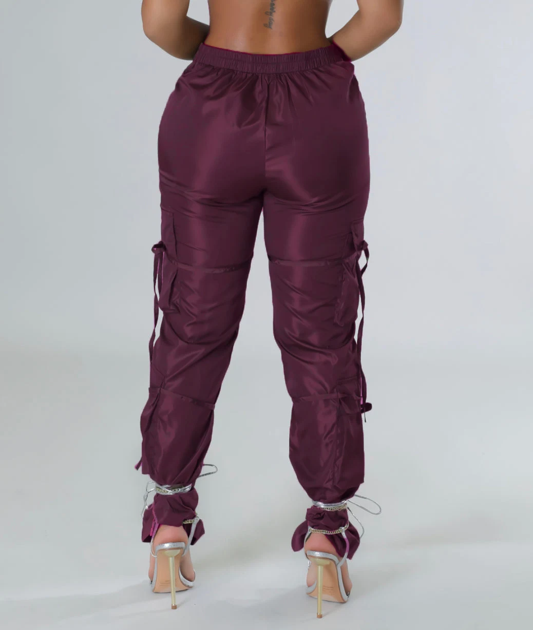 Women's green solid color casual trousers with zipper closure and strap, offering comfort and style for everyday wear an — photo 16