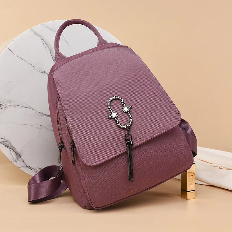 Mochila fashion de cor sólida, repelente à água e grande capacidade. Perfeita para transportar seus pertences com segurança e estilo em diversas situações. — foto 6