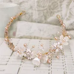 Gouden keramieken haarband met parels, een stijlvol accessoire dat uw kapsel verfraait met een vleugje elegantie en glans. — foto 1