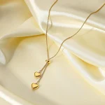 Colar coreano de coração duplo tridimensional com brilho, um acessório elegante e romântico. Ideal para presentear ou usar no dia a dia. — foto 3