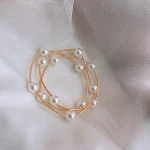 Pulseira de pérolas cruzadas multicamadas feminina, temperamento charmoso, acessório elegante, ideal para realçar sua beleza e estilo pessoal. — foto 6