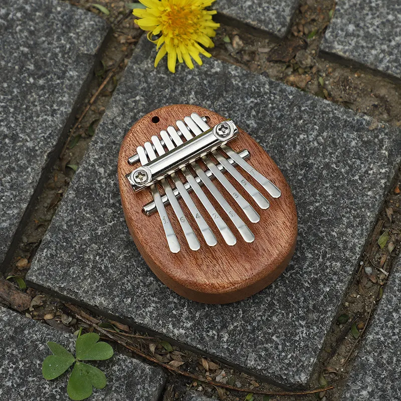 Mini Piano de Polegar 8 Tons Madeira Maciça Cristalina Instrumento musical portátil e transparente para iniciantes. Toque melodias relaxantes — foto 4