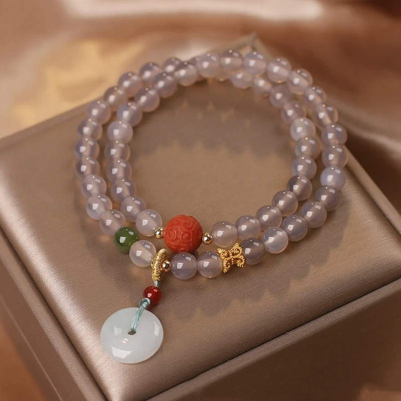 Pulseira de contas multicamadas chinesa cinza natural. Elegância e versatilidade em uma peça única. Um toque de sofisticação para o seu visual diário. — foto 10