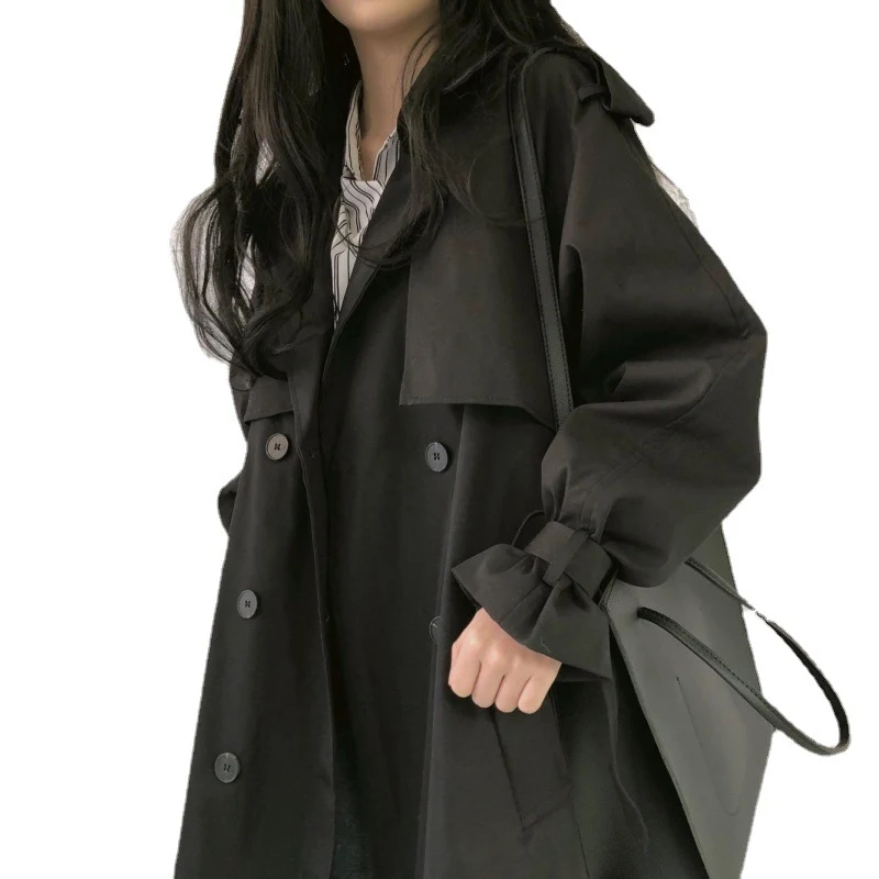 Women's black trench coat, mid-length, double-breasted, with a cinched waist for a flattering silhouette, a versatile an — photo 1