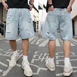 Ripped denim shorts, loose and casual, distressed details. These shorts offer a relaxed and stylish look, perfect for ev — photo 1