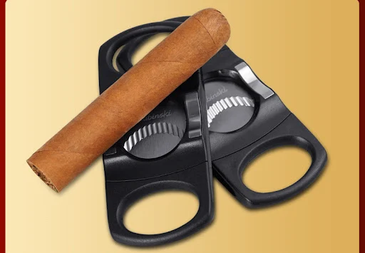 Title 2, Portable serrated double-edged cigar cutter. Sh...