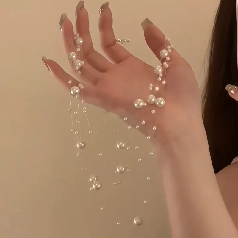 Colar de pérolas multicamadas feminino, corrente de clavícula elegante, acessório perfeito para realçar sua beleza e estilo. — foto 1