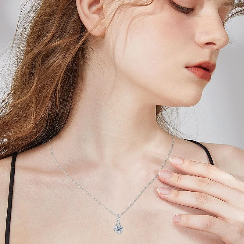 Colar feminino de prata com design moderno e moissanita em gota, perfeito para um toque de sofisticação e elegância em seu visual. — foto 9