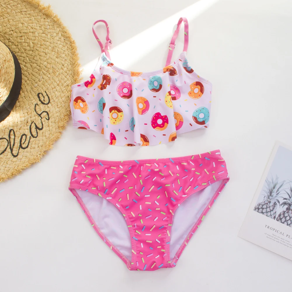 Maiô duas peças infantil TEMU da Amazon, com estampa de donut e cores contrastantes. Traje de banho divertido e moderno para meninas. — foto 3
