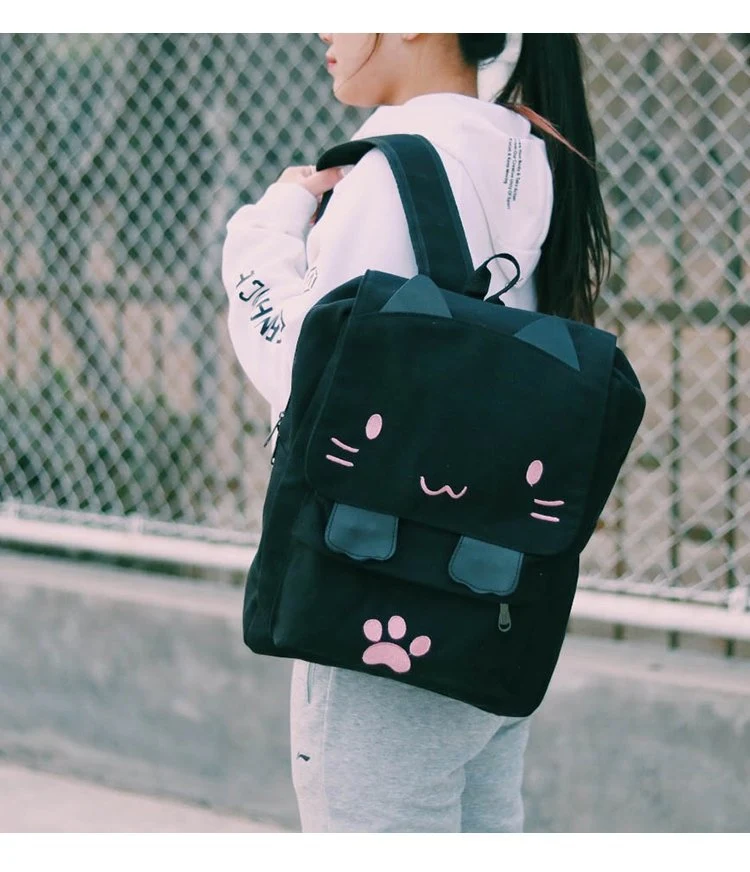 Mochila de lona bordada com desenho de gato para crianças. Leve, resistente e ideal para escola, com design de desenho animado fofo e funcional. — foto 7