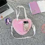 Bolsa transversal transparente em formato de coração, combina com tudo e é perfeita para looks leves e modernos, ideal para diversas ocasiões e estilos. — foto 14