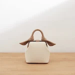 Bolso de mano diagonal texturizado para mujer con un solo hombro, elegante y versátil para cualquier ocasión, compra el tuyo ahora. — foto 1