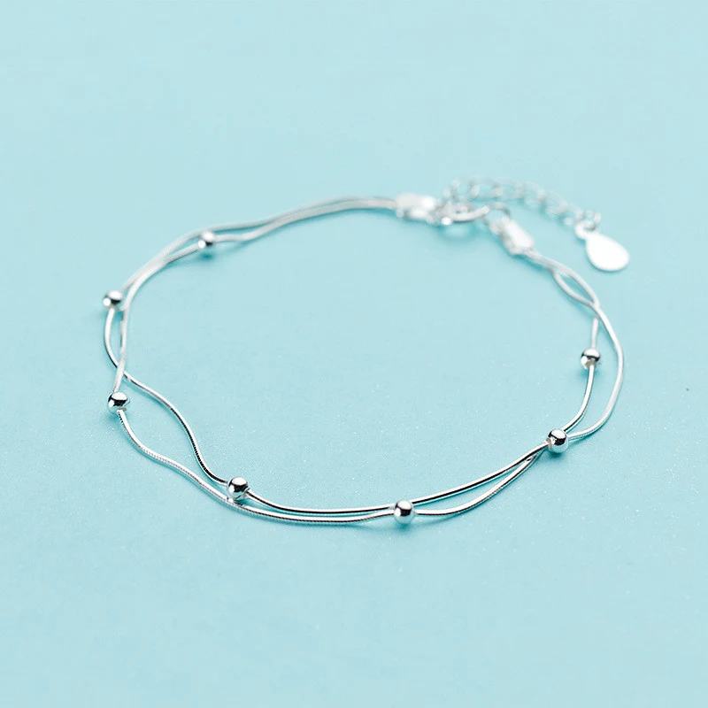 Pulseira Dupla Camada Simples e Elegante. Um acessório charmoso para o dia a dia, adicionando um toque de sofisticação ao seu visual. — foto 1