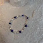 Faceted cyan gold pearl