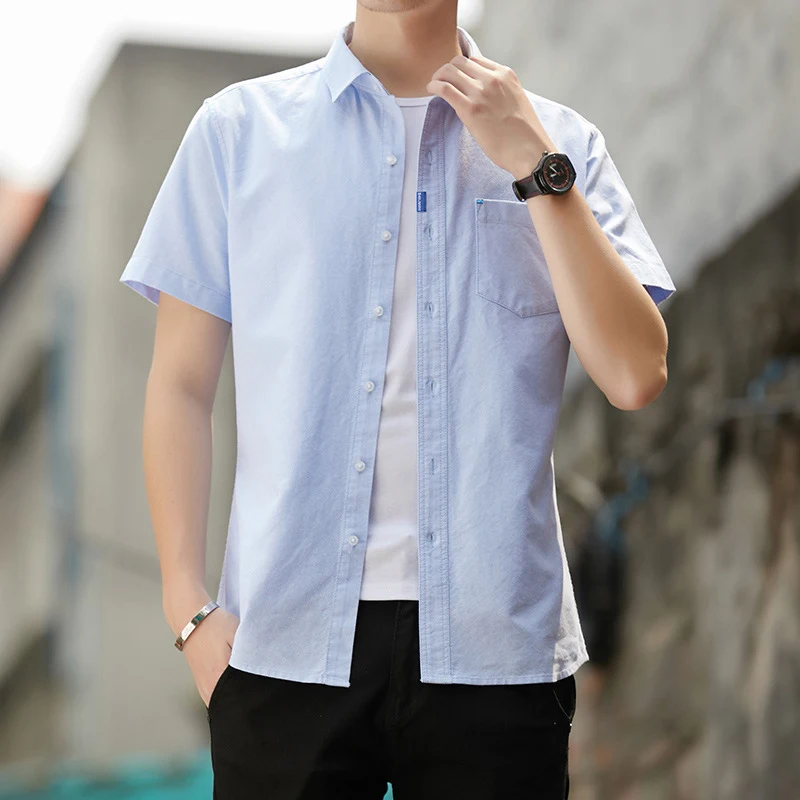 Camisa masculina casual de cor sólida para negócios. Conforto e estilo para o dia a dia profissional e ocasiões descontraídas. Fácil de combinar. — foto 1