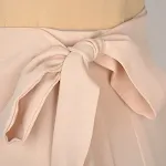 Saia de uma peça com cadarço, irregular, efeito "pack buttock" e cor sólida. Perfeita para um look estiloso e moderno. — foto 9