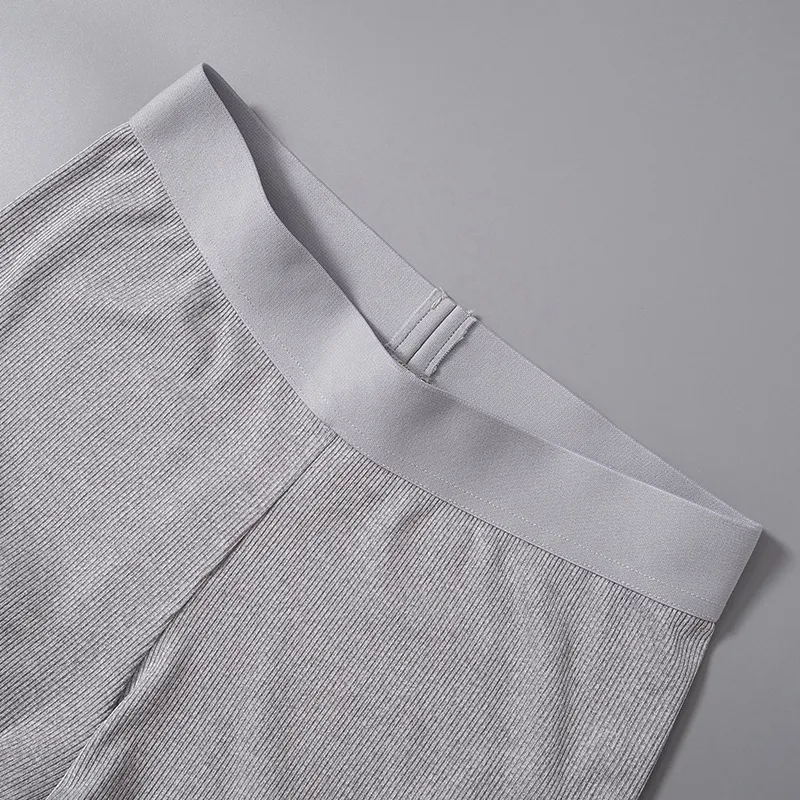 Conjunto duas peças top cropped manga curta e calças casuais, perfeito para um visual moderno e confortável. Ideal para o dia a dia. — foto 21