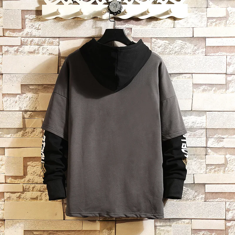 Moletom com capuz e bloco de cores, ideal para um visual casual e moderno. Conforto e estilo para os dias frios, perfeito para você. — foto 2