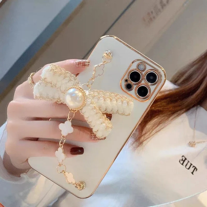 Title 3, Capinha de celular com pulseira de eletroplasti...