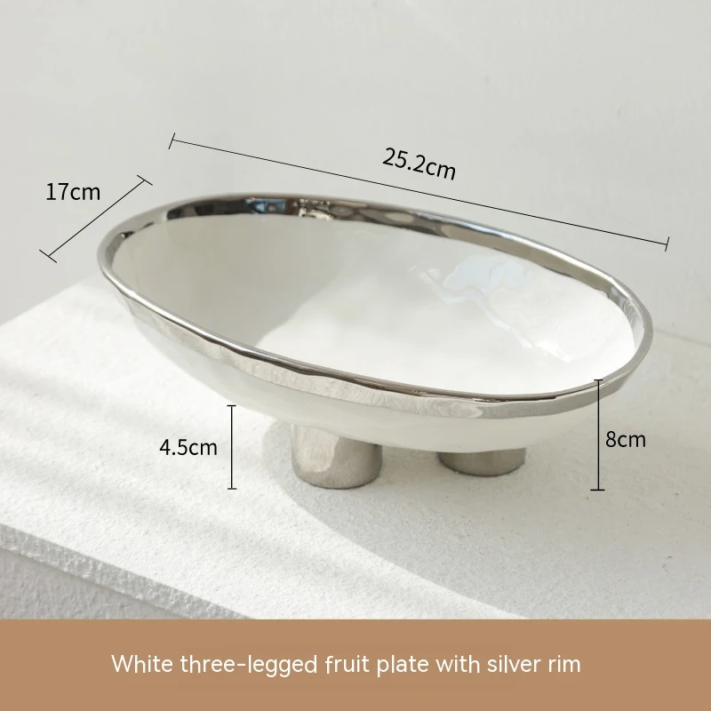 Handmade porcelain modern minimalist ceramic fruit plate with three feet, elevating fruit display and adding a touch of — photo 25