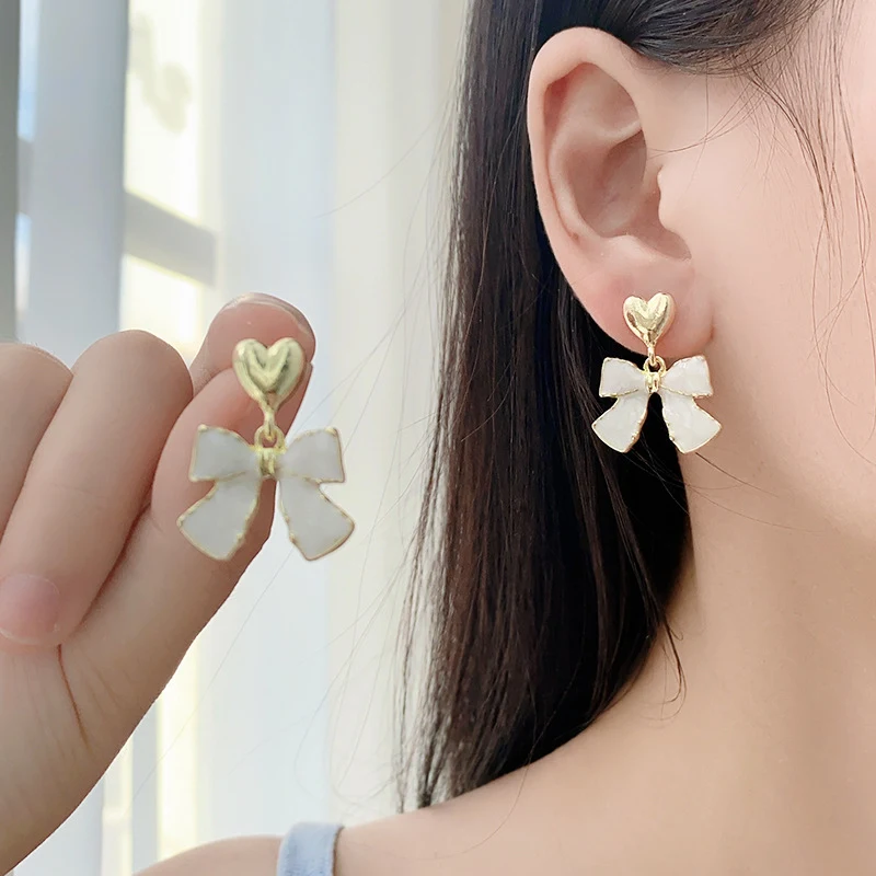 S925 Silver Needle Sweet Bow Love Earrings. Add a touch of elegance and charm. These earrings are perfect for any occasi — photo 3