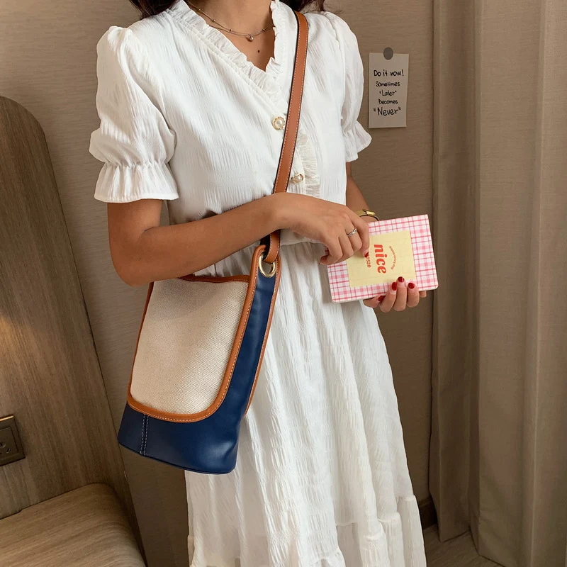 Bolso de cubo de lona de color simple para mujeres Ideal para uso diario Espacioso y versátil Diseño elegante y ligero Perfecto para llevar tus esenciales — foto 1