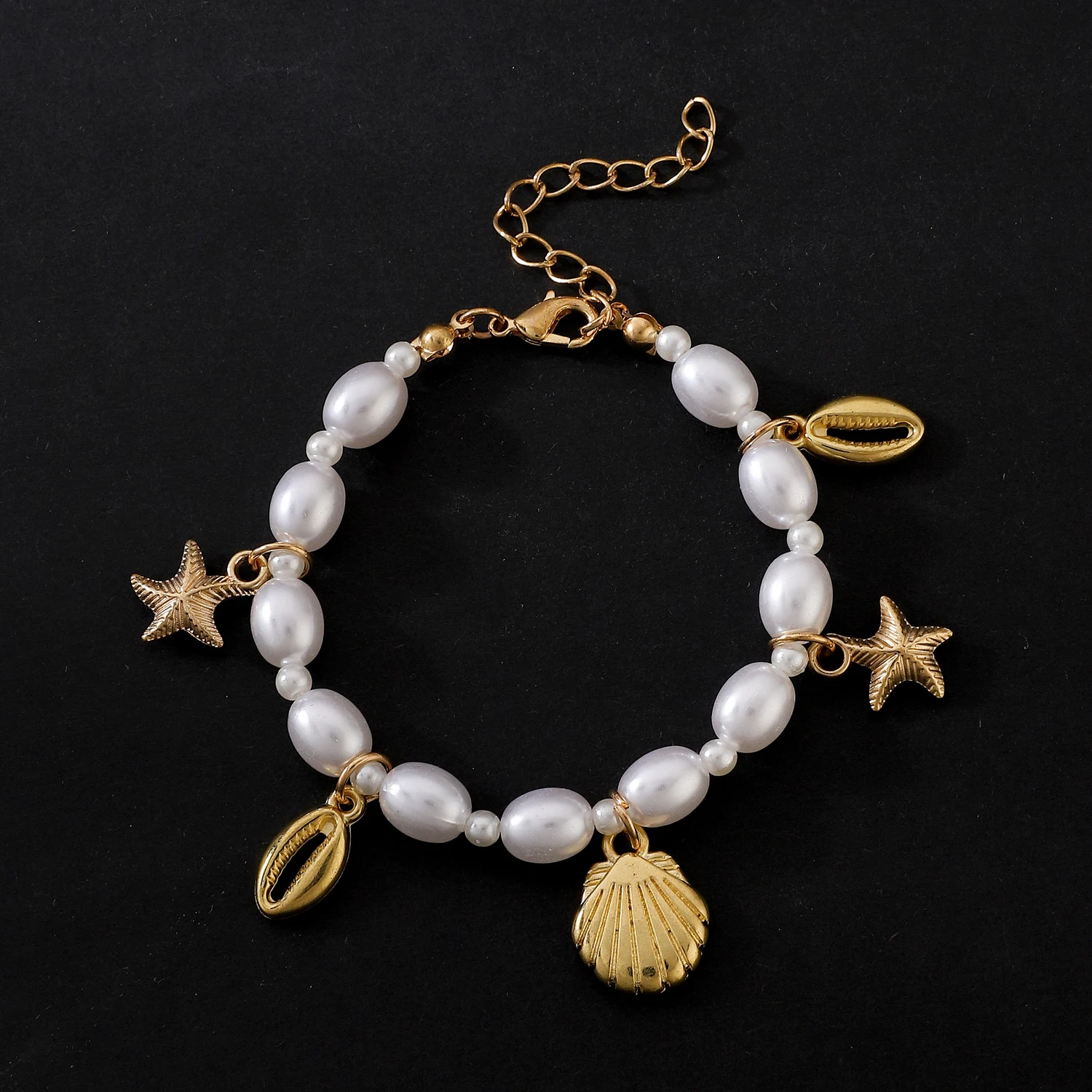 Pulseira feminina de moda com pérolas irregulares, estrela do mar e concha. Um acessório charmoso e elegante para complementar seu visual. — foto 4