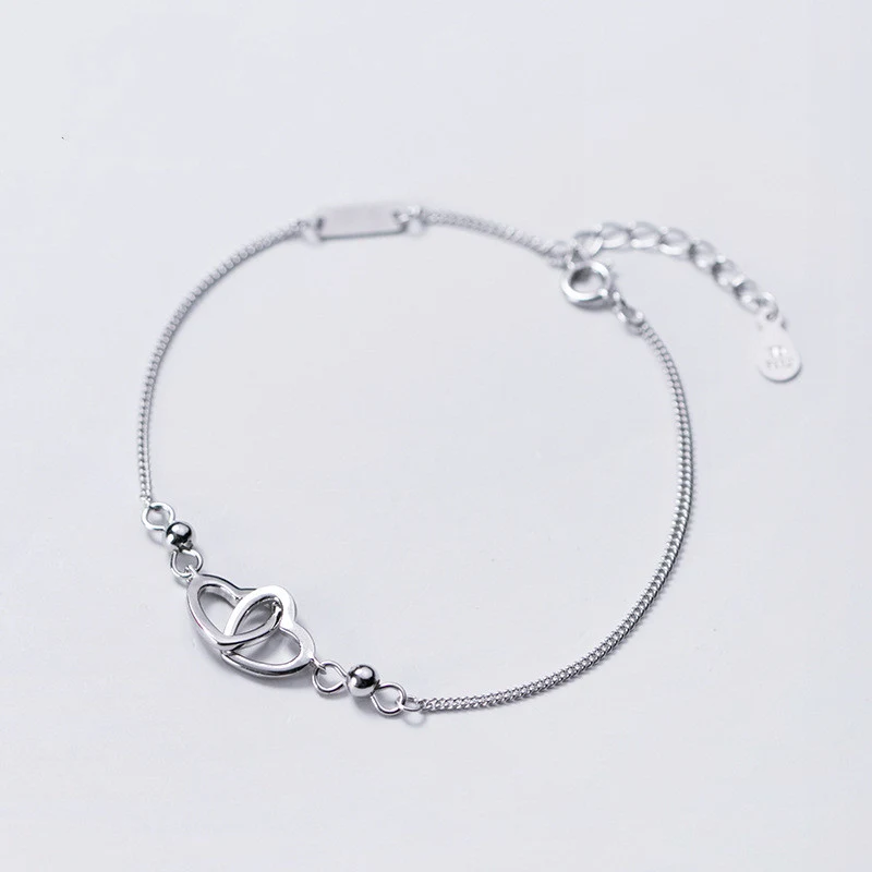 Pulseira de Prata Feminina Brilhante Vazada Adicione um toque de elegância ao seu visual com esta pulseira deslumbrante. Design vazado e brilho que te destacam. — foto 1