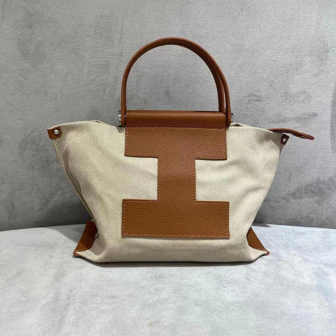 Bolsa transversal casual de lona para mulheres, com couro bovino na camada superior, ideal para uso diário e moderno. — foto 5