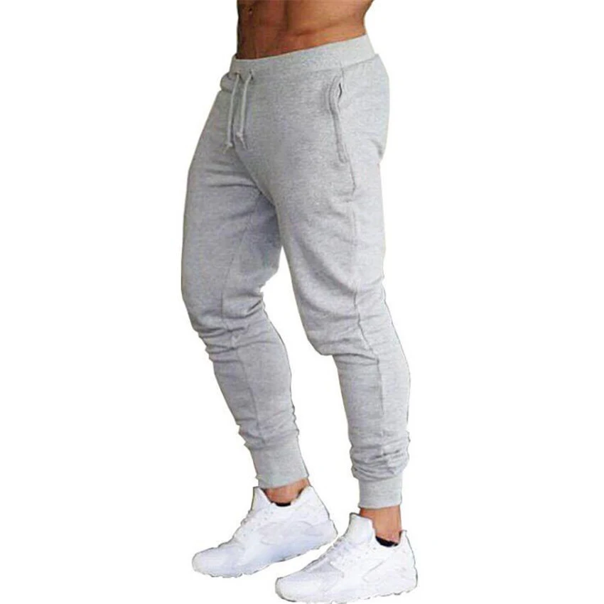 Calças esportivas masculinas de fitness, sólidas e perfeitas para treinos. Conforto e estilo para suas atividades físicas e exercícios. — foto 2