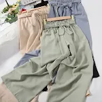 Ležerne pantalone u jednoj boji sa elastičnim strukom i modnom trakom, savršene za svakodnevno nošenje i udobnost. — foto 6