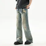 Graffiti distressed dirty ripped denim trousers for a bold urban look. Stylish and comfortable jeans, perfect for a mode — photo 1