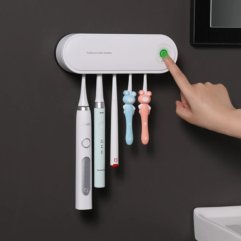 Title 2, Toothbrush sterilizer with UV light. Kills germ...