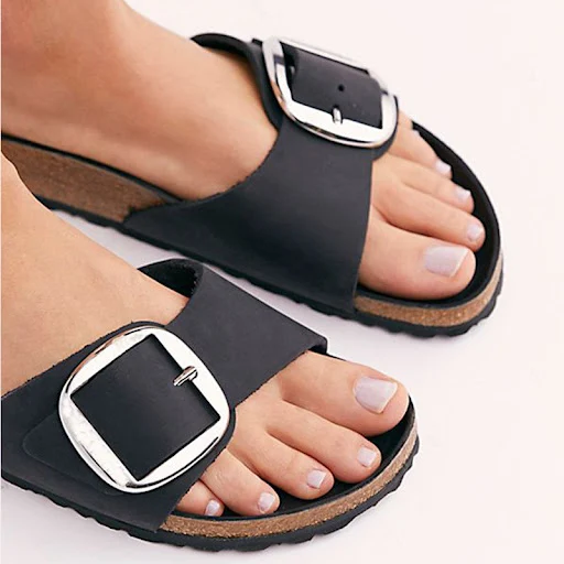 Title 2, Flat-bottomed flip flops with button detail for...