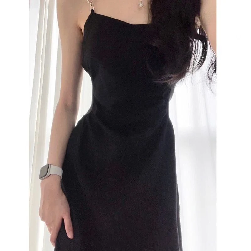 Title 10, Black Camisole Dress with a waist slimming desi...