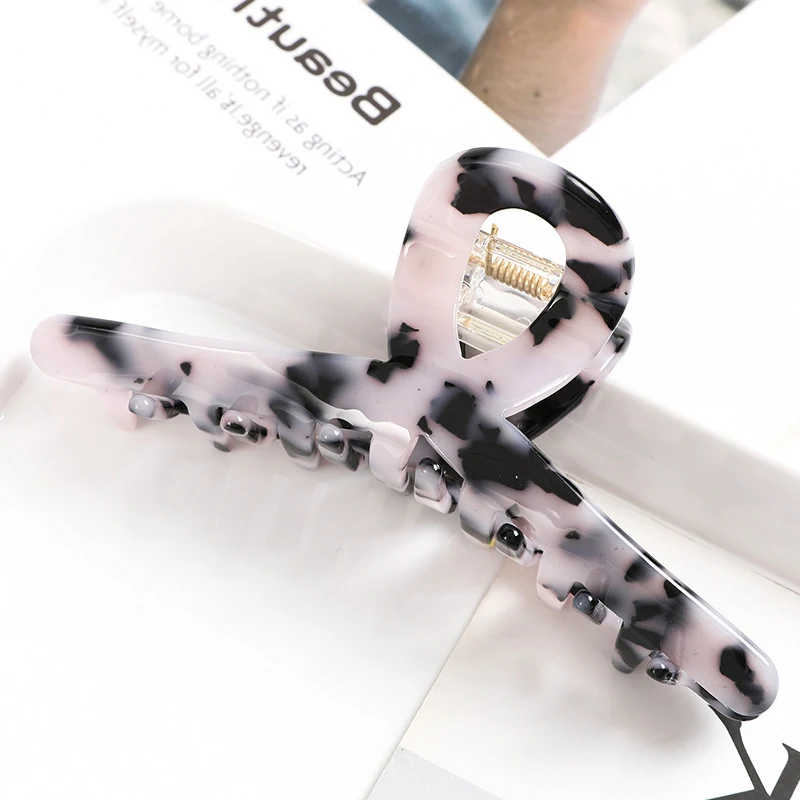Presilha simples de acetato feminina com agarre cruzado, ideal para prender o cabelo com praticidade e elegância, perfeita para penteados rápidos. — foto 1