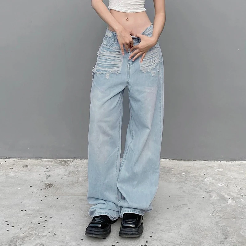 Women's Fashionable Ripped Denim Trousers for a trendy and comfortable look. Stylish jeans with a distressed design, per — photo 1