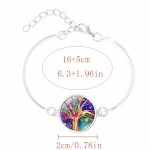 Conjunto de brincos, colar e joias com árvore da vida e pedras preciosas. Adicione um toque especial ao seu visual com este conjunto elegante. — foto 3