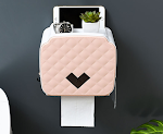 Wall-mounted tissue holder for convenient access and space-saving design. Keeps tissues within reach and adds a modern t — photo 1