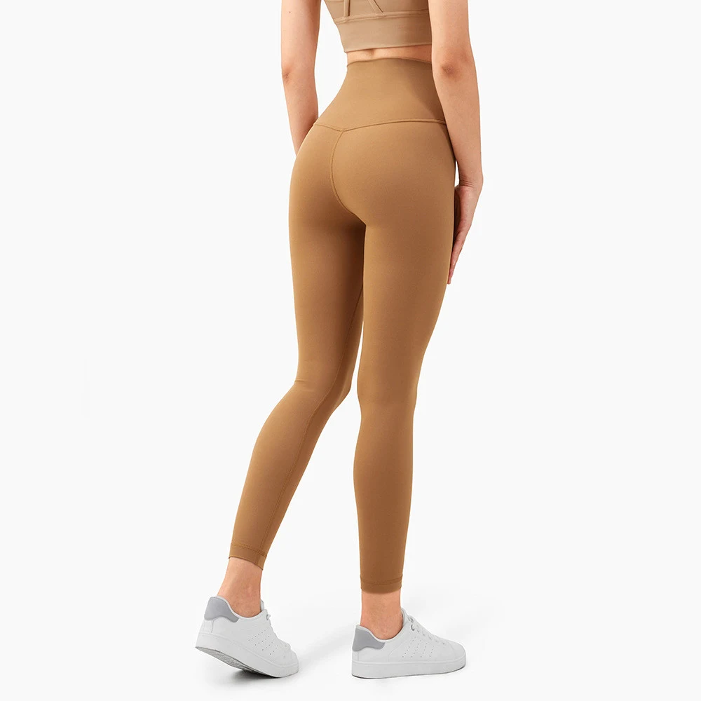 Skin-friendly nude high-waisted peach hip-lifting yoga pants for women. Fitness tights designed for comfort and performa — photo 19