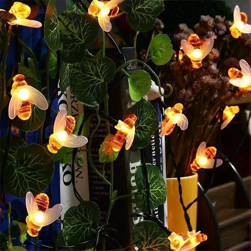 Title 4, Solar string lights with bee decorations. Add c...