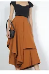 Saia feminina midi com babados e camadas irregulares. Um visual moderno e charmoso, ideal para diversas ocasiões e combinações. — foto 4