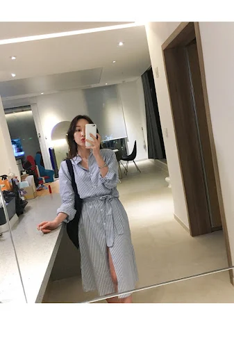Title 3, Striped shirt skirt with a slit offering a styl...