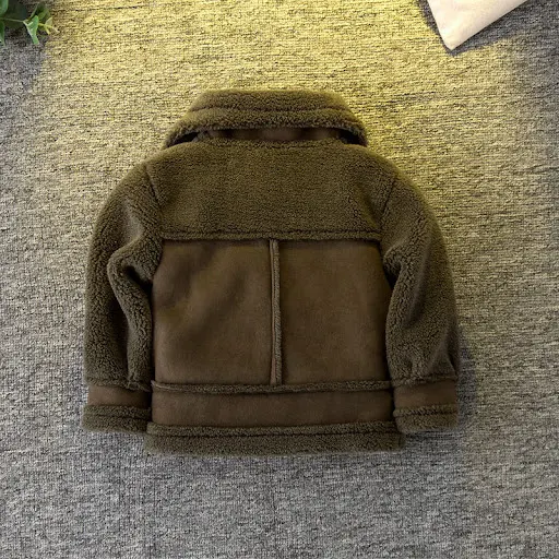 Title 7, Brown long-sleeved short jacket for children. P...